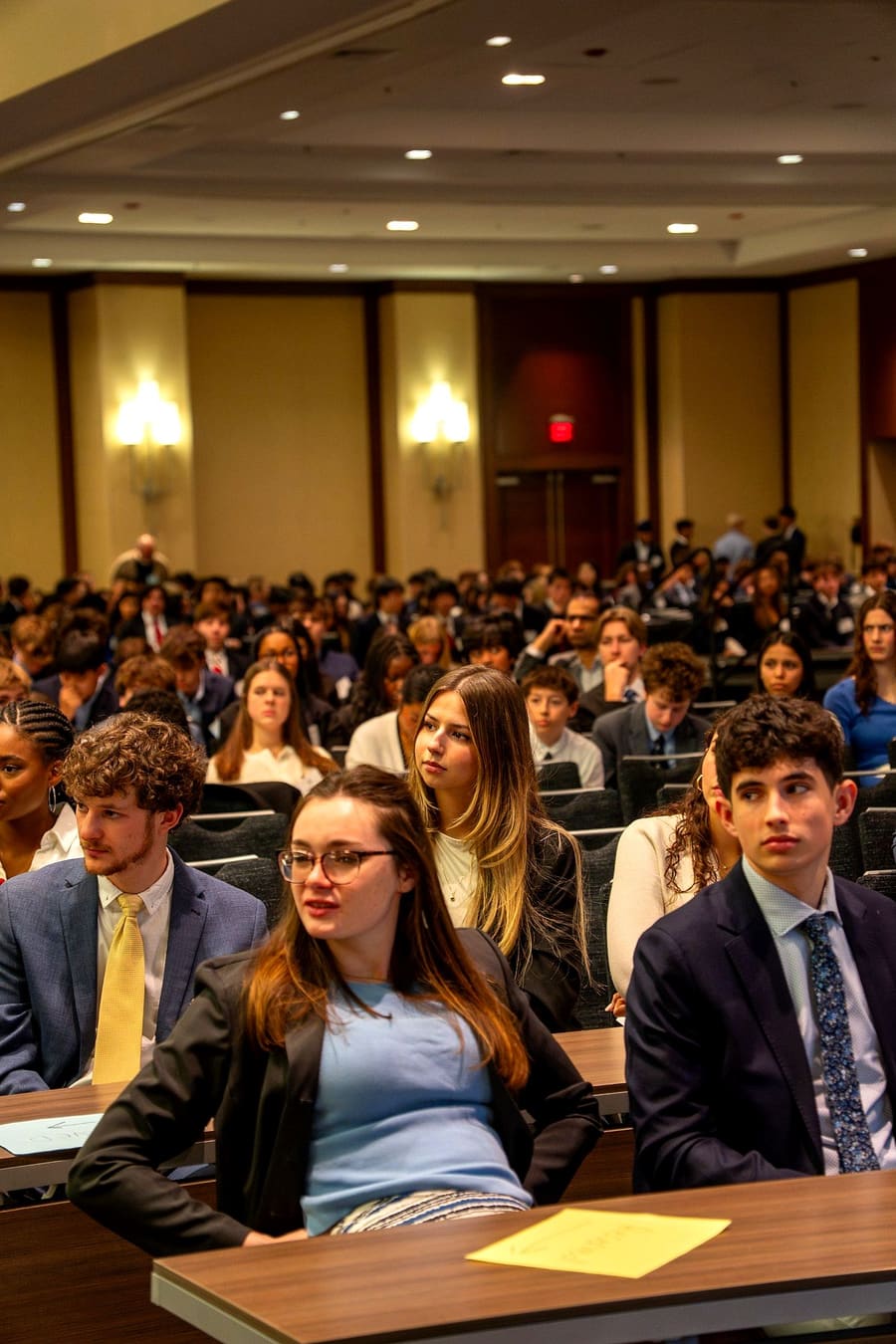 Delegates listening intently during a committee session